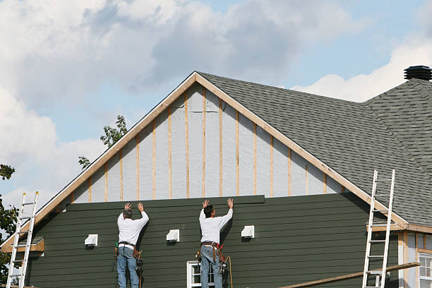 Professional Siding Replacement technician working in Lake Grove, NY